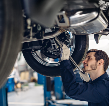 auto-car-repair-service-center-mechanic-examining-car-suspension