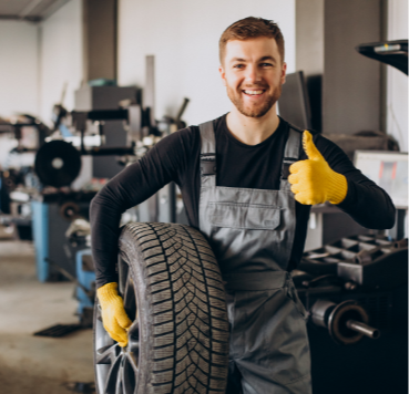 car-mechanic-changing-wheels-car